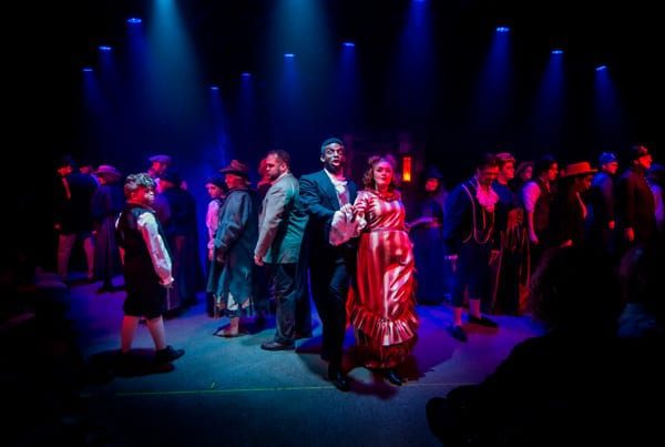 This cast photo is a true testament to the brilliance of Michael Thomas' staging and Aaron Nicolas' lighting.